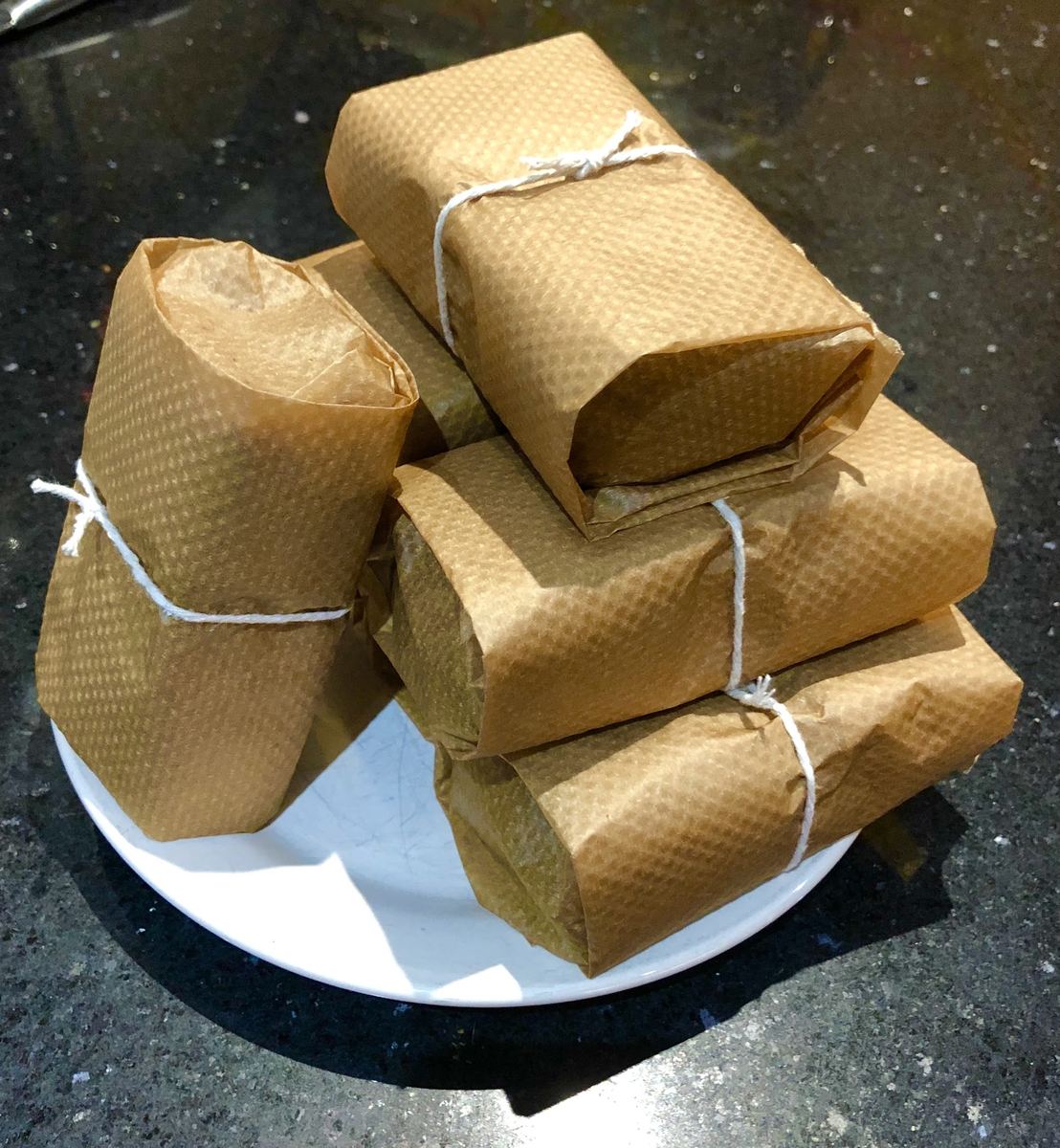 Home-made cake, wrapped in brown paper for the journey home